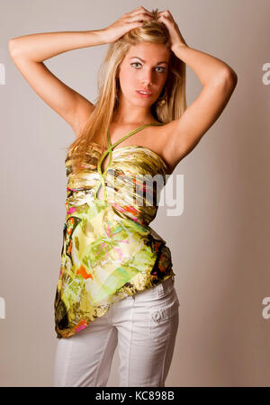 Blonde High Fashion Model Posing in Studio Stock Photo