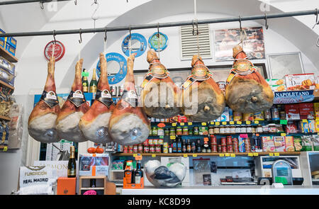 Cured meats hanging in a delicatessen shop in Amalfi  Italy Stock Photo