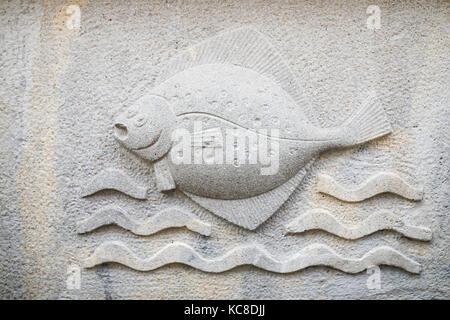 Ornaments, mouldings, gargoyle, low reliefs in a sandstone, granite, concrete. sculpting details in Gdansk (Danzig).  Mariacka street (Mariengasse) an Stock Photo