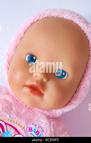 Close up detail of face of cute Zapf Creation My Little BABY Born Super Soft Doll toy set on white background Stock Photo