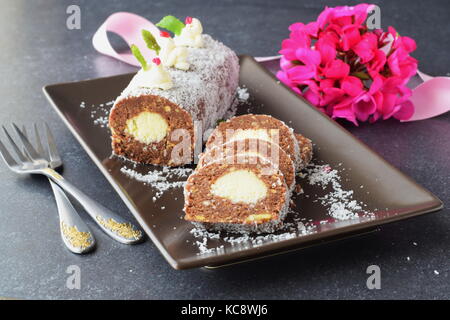 Homemade biscuit roll with coconut filling without baking sliced Stock Photo