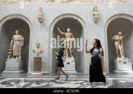 Rome. Italy. Visitors in the Braccio Nuovo Sculpture Gallery, Chiaramonti Museum, Vatican Museums. Musei Vaticani. Stock Photo