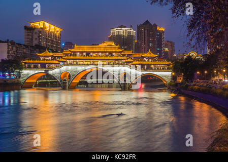 Beautiful Anshun Bridge at Chengdu, Sichuan, ablaze with lights during dusk. Stock Photo