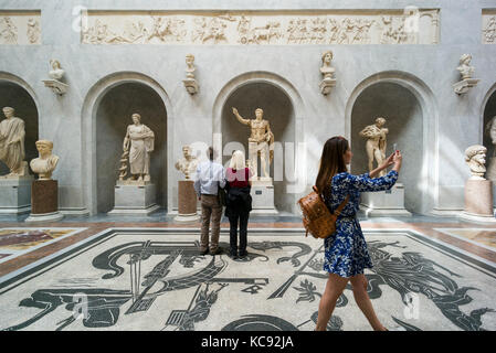 Rome. Italy. Visitors in the Braccio Nuovo Sculpture Gallery, Chiaramonti Museum, Vatican Museums. Musei Vaticani. Stock Photo