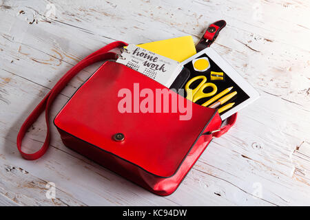 Desk with tablet and school supplies. Studio shot on white wooden background. Flat lay. Stock Photo
