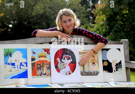 Auctioneer Catherine Southon holds examples from the Smilby cartoon collection, including works that appeared in Playboy, at the Ripley Arts Centre, Bromley, ahead of their auction next month. Stock Photo