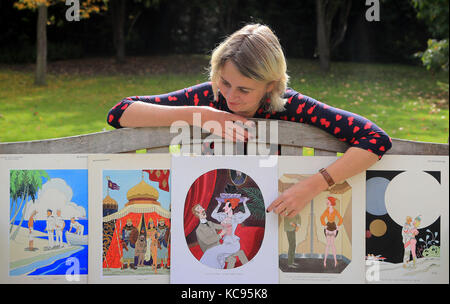 Auctioneer Catherine Southon holds examples from the Smilby cartoon collection, including works that appeared in Playboy, at the Ripley Arts Centre, Bromley, ahead of their auction next month. Stock Photo