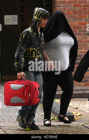 Kati Ringer (face obscured) leaves Norwich Magistrates' Court where she appeared for sentencing. Stock Photo