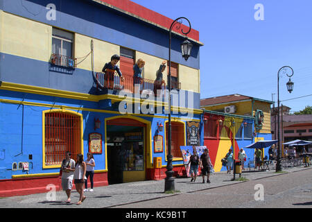 BUENOS AIRES, ARGENTINA, JANUARY 5, 2014 : Streets of La Boca. This district is a popular destination, with its colourful houses and pedestrian street Stock Photo