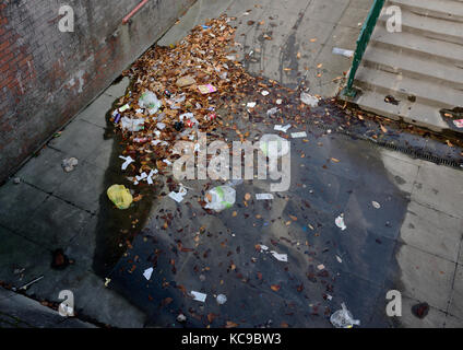Leaves and litter and rubbish in underpass radcliffe bury lancashire uk Stock Photo