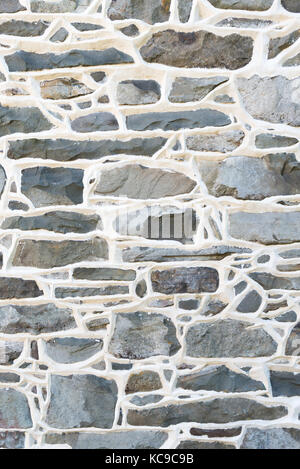 Historic Stone Wall Detail from 1700's residence with raised mortar joints. Stock Photo