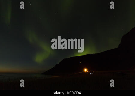 Northern lights over Unstad Beach, the surfers paradise in Lofoten Islands, Norway Stock Photo