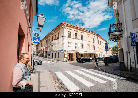 Vilnius, Lithuania - July 5, 2016: Man Citizen Standing On Street Uzupio Of Uzupis Located In Old Town Of Vilnius. District Of Vilniaus Senamiestis. Stock Photo