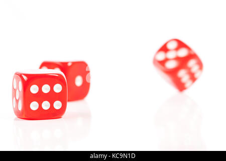 Red Casino Dice in Movement on White Background Stock Photo