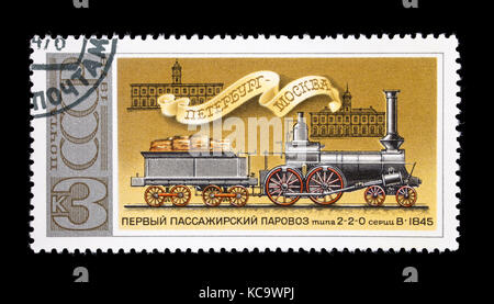 Postage stamp from the Soviet Union depicting a 2-2-0 steam locomotive from 1845 and the Moscow and St. Petersburg  train stations. Stock Photo