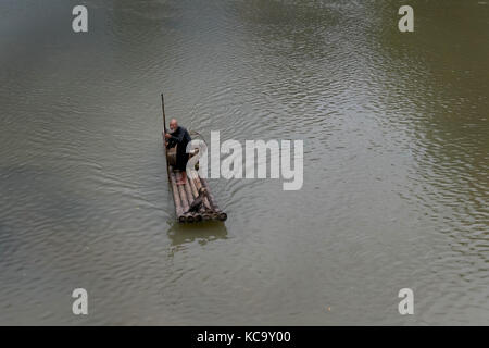 Old Chinese fisherman on bamboo draft with cormorants on Li River near Xingping, between Yangshuo and Guilin, Guangxi, China, Asia Stock Photo