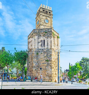 ANTALYA, TURKEY - MAY 12, 2017: The clock tower is the city symbol, located in Cumhuriyet avenue, Kaleici, on May 12 in Antalya. Stock Photo