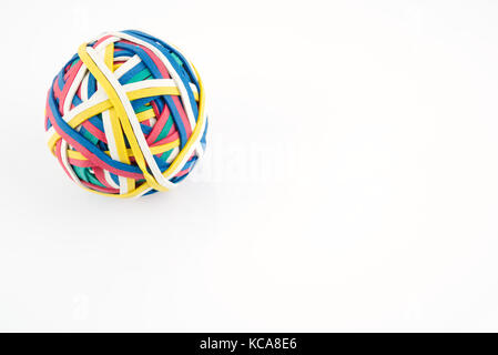 Rubber band ball made from many colourful elastic bands isolated on a white background
