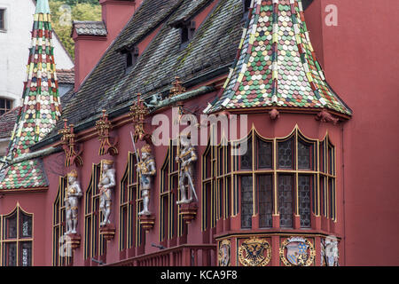 City of Freiburg, Germany. Picturesque front façade view of the Historical Merchants Hall in Minster Square. Stock Photo