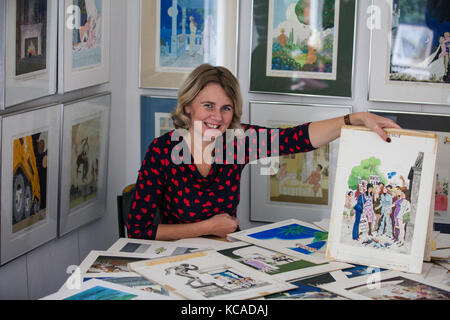 Bromley, UK. 3rd October, 2017. Auctioneer Catherine Southon poses with cartoons by Smilby (Francis Wilford-Smith, 1927-2009), one of the most successful cartoonists of his day and best known for his work for Playboy and Punch. Part 1 of the Smilby Cartoon Collection will be auctioned by Catherine Southon Auctioneers & Valuers on 1st November 2017. Credit: Mark Kerrison/Alamy Live News Stock Photo