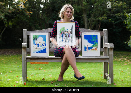 Bromley, UK. 3rd October, 2017. Auctioneer Catherine Southon poses with cartoons by Smilby (Francis Wilford-Smith, 1927-2009), one of the most successful cartoonists of his day and best known for his work for Playboy and Punch. Part 1 of the Smilby Cartoon Collection will be auctioned by Catherine Southon Auctioneers & Valuers on 1st November 2017. Credit: Mark Kerrison/Alamy Live News Stock Photo