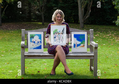 Bromley, UK. 3rd October, 2017. Auctioneer Catherine Southon poses with cartoons by Smilby (Francis Wilford-Smith, 1927-2009), one of the most successful cartoonists of his day and best known for his work for Playboy and Punch. Part 1 of the Smilby Cartoon Collection will be auctioned by Catherine Southon Auctioneers & Valuers on 1st November 2017. Credit: Mark Kerrison/Alamy Live News Stock Photo