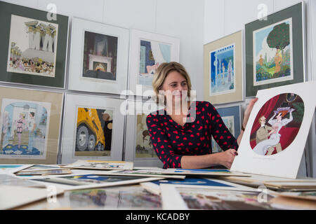 Bromley, UK. 3rd October, 2017. Auctioneer Catherine Southon poses with cartoons by Smilby (Francis Wilford-Smith, 1927-2009), one of the most successful cartoonists of his day and best known for his work for Playboy and Punch. Part 1 of the Smilby Cartoon Collection will be auctioned by Catherine Southon Auctioneers & Valuers on 1st November 2017. Credit: Mark Kerrison/Alamy Live News Stock Photo