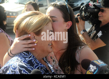 Fort Lauderdale, Florida, USA. 03rd Oct, 2017. Ingrid Fernandez (left), a victim of Hurricane Maria, embraces with her daughter at Port Everglades in Fort Lauderdale, Florida on October 3, 2017 after being evacuated from Puerto Rico on board the Royal Caribbean cruise ship Adventure of the Seas. The ship departed San Juan, Puerto Rico on September 28 before picking up evacuees and delivering relief supplies in St. Croix and St. Thomas. The approximately 3,800 passengers brought to Florida included a number of stranded tourists. (Paul Hennessy/Alamy) Stock Photo