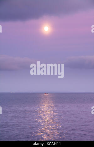 Mousehole, Cornwall, UK. 3rd Oct, 2017. UK Weather. It was a fine end to the day at Mousehole in the far south west of Cornwall, with a nearly full Harvest Moon. Credit: Simon Maycock/Alamy Live News Stock Photo