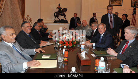 Baghdad, Iraq - December 14, 2008 -- Vice President Adel Abdul Mahdi of Iraq, 3rd left, United States President George W. Bush, 3rd right, President Jalal Talabani of Iraq, 2nd left, Vice President Tareq al-Hashimi of Iraq, left, and United States Ambassador to Iraq Ryan Crocker, right, attend a meeting at Salam Palace in Baghdad on Sunday, December 14, 2008. Bush made a farewell visit to Baghdad on Sunday to sign a security pact between Washington and Baghdad that paves the way for U.S. forces to withdraw by the end of 2011. Credit: Office of the President of Iraq via CNP /MediaPunch Stock Photo