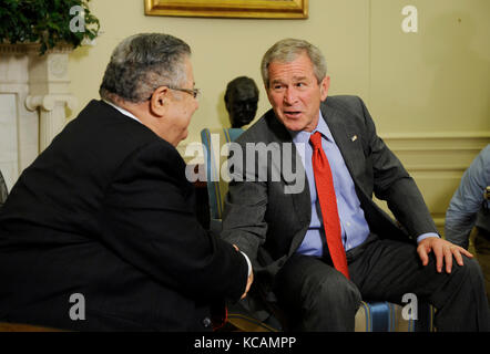 Washington, DC - June 25, 2008 -- United States President George W. Bush shakes hands with the President of Iraq Jalal Talabani after a meeting in the Oval Office of the White House in Washington, DC USA 25 June 2008. A roadside bombing killed three U.S. soldiers yesterday in northern Iraq, bringing the number of American troop deaths this week in the country to seven. Credit: Shawn Thew/Pool via CNP /MediaPunch Stock Photo