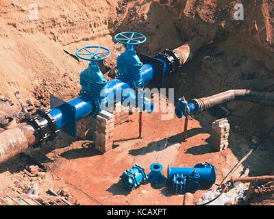 500 mm drink water Gate valve joint with screwed pipe fitting - repairing of main water pipeline underground Stock Photo