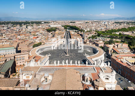 View of St Peter's Square and the rooftops of Rome from the dome of St Peter's basilica in the Vatican city in Rome. Stock Photo