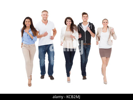 A Group Of Multi Ethnic People Running On White Background Stock Photo