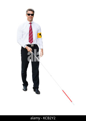 Portrait Of A Blind Man Wearing Yellow Arm Band And White Stick On White Background Stock Photo