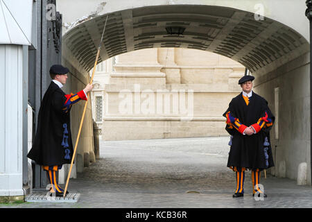 ROMA, ITALY - APRIL 4 : Papal Swiss Guard in uniform at the gates of Vatican, in Rome, Italy on April 4, 2013 Stock Photo