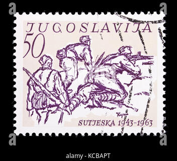 Postage stamp from Yugoslavia depicting partisans in battle, 20th anniversary of the Battle of Sutjeska. Stock Photo