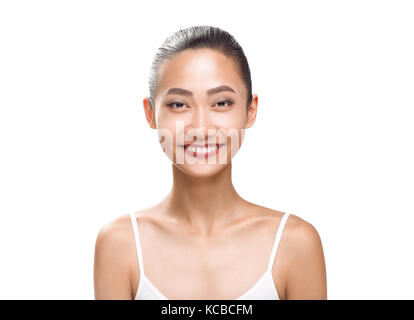 Beauty portrait of smiling asian woman with tanned clean skin isolated on white Stock Photo