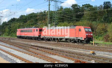 DB Class 155 (left) and DB Class 185 (right) electric locomotives at Koln-Gremberg, Germany Stock Photo