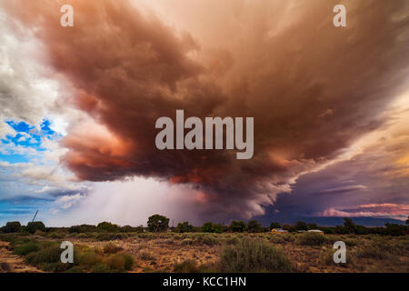 Thunderstorm clouds and dramatic sunset sky near Belen, New Mexico Stock Photo