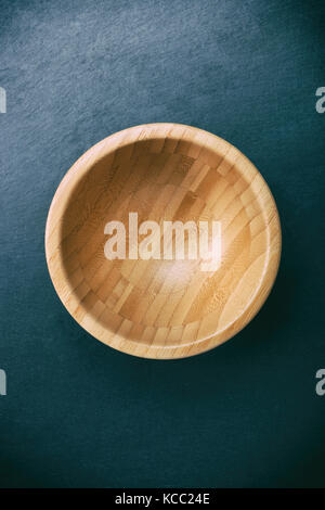 Wmpty wooden bowl on black late. Stock Photo