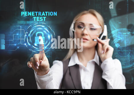 Young businesswoman working in virtual glasses, select the icon PENETRATION TEST on the virtual display Stock Photo