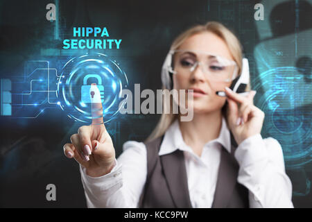 Young businesswoman working in virtual glasses, select the icon Hippa Security on the virtual display Stock Photo