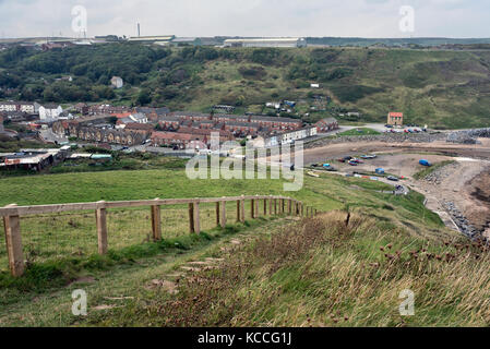 The village of Skinningrove on the Cleveland coast, seen from the Cleveland Way footpath, UK. The steel works is seen above the village. Stock Photo
