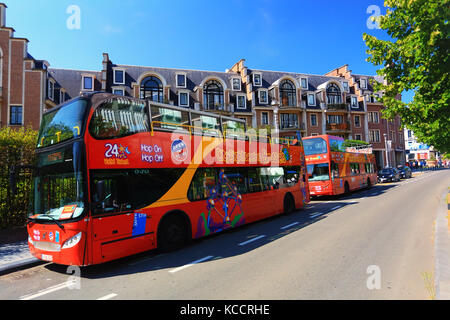Brussels, Belgium - July 17, 2017: Red tourist buses of City Sightseeing Brussels. Famous Hop-On Hop-Off tourist buses on a sunny day in Brussels. Stock Photo
