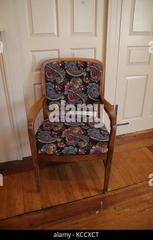 Revolutionary War era chair in a colonial house on a wooden floor Stock Photo