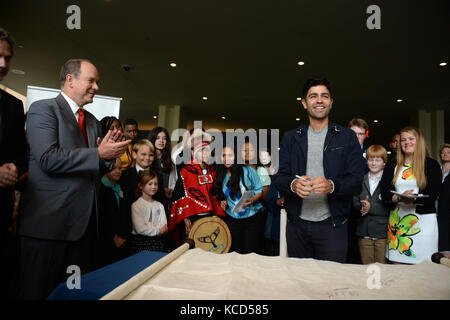 NEW YORK, USA - JUNE 08:  UN Ocean Conference in New York UNHQ PRINCE ALBERT II  AND ADRIAN GRANIER   sign  ocean pledge with children from around the world  at the United Nations (UN) Headquarters in New York, NY, United States on June 08, 2017    People:  Adrian Grenier  Transmission Ref:  MNC1  Credit: Hoo-Me.com/MediaPunch Stock Photo