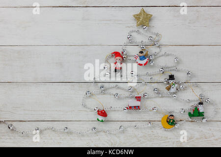 Aerial view of Merry Christmas tree with decorations concept background.Several items on modern rustic white wooden at home office studio desk.free sp Stock Photo