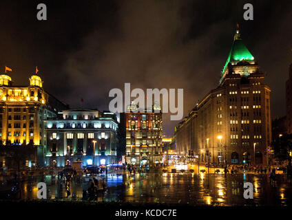 View of the skyscrapers at night along Nanjing Road and Zhongshan Road in Shanghai, China.  This areas is also popularly called the Shanghai Bund. Stock Photo