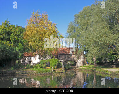 A view of Pulls Ferry by the River Wensum in early autumn in Norwich, Norfolk, England, United Kingdom. Stock Photo